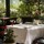 outdoor terrace table laid at Bentley's Oyster Bar & Grill seafood restaurant in Mayfair, London