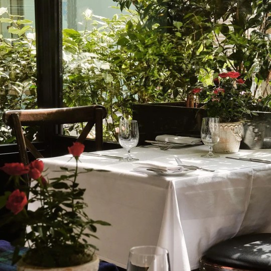 outdoor terrace table laid at Bentley's Oyster Bar & Grill seafood restaurant in Mayfair, London